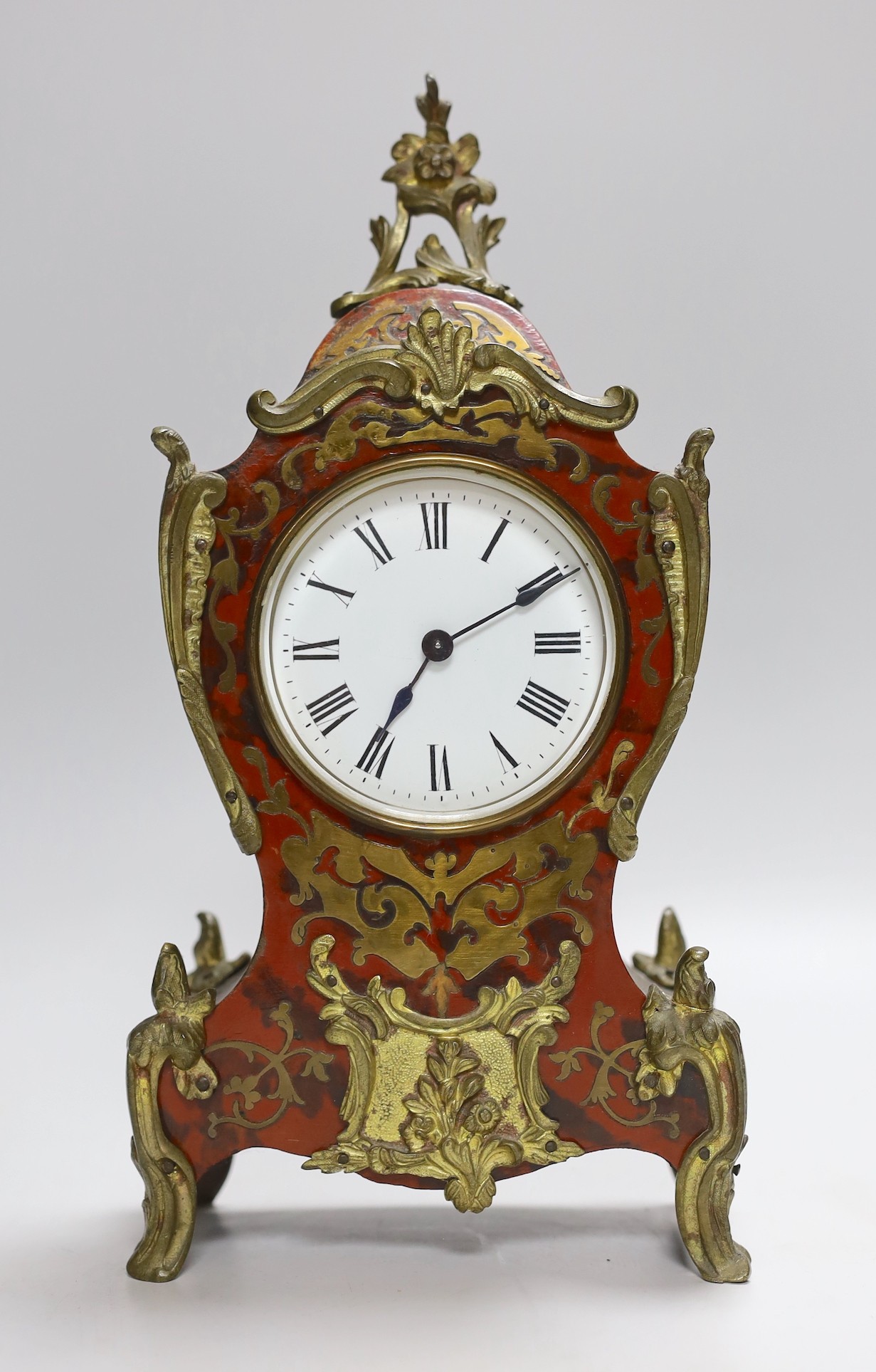 A late 19th century Boulle work mantel timepiece with key, 31cms high